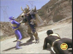 Black and Blue Rangers fight a Mutorg